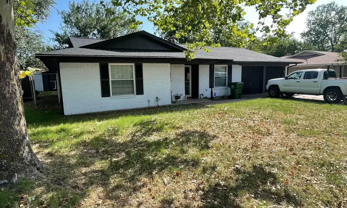 Professional roofing crew working on a residential roof in Bel Air South